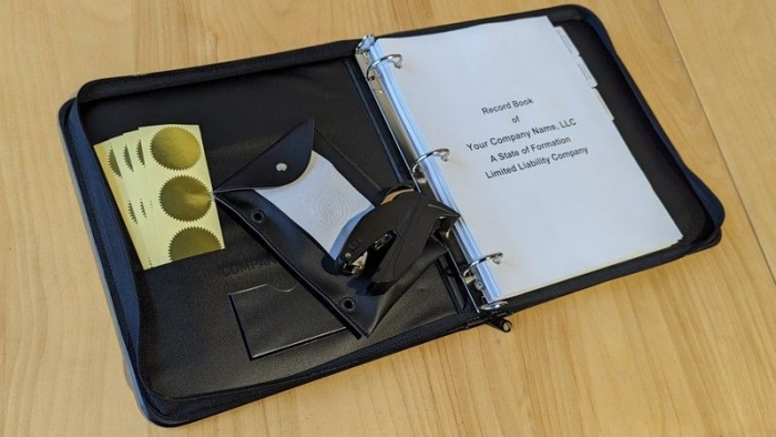 GoBook binder for storing corporate documents, plus an embossing seal.